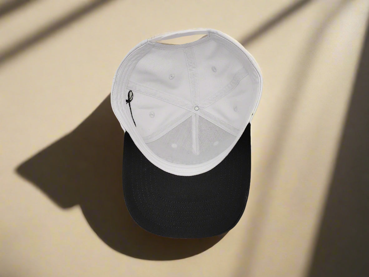 Black cap with white interior on a light gray background