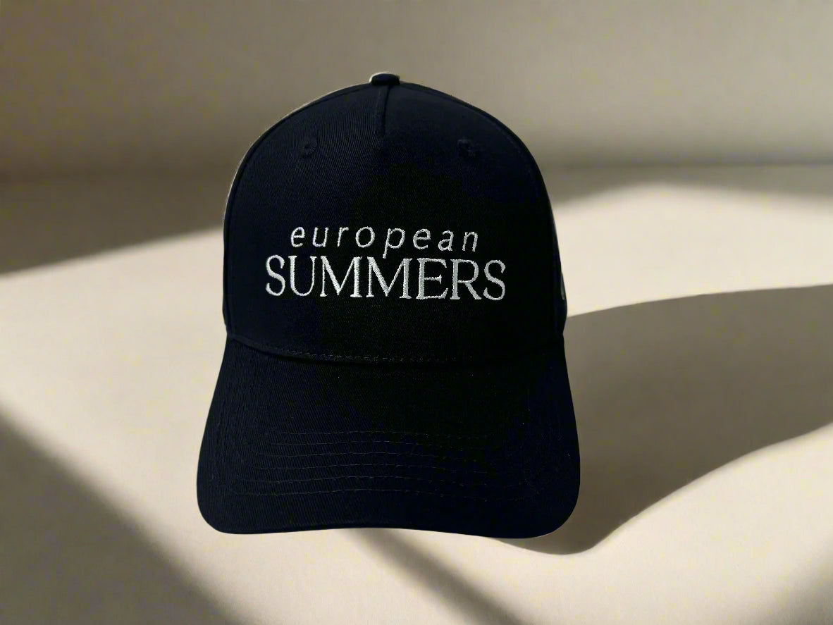 Black cap with 'European Summers' text on a white embroidery snapback premium hat